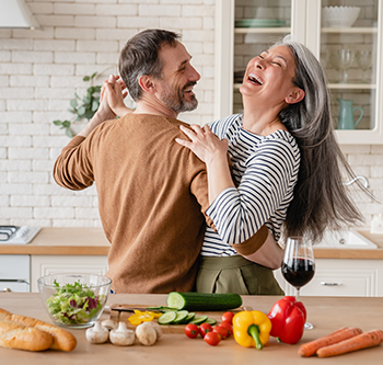 Couple dancing in a kitchen